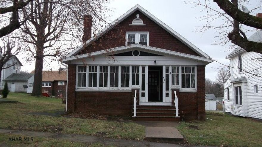 Brick cape with lots of charm - hardwood floors, built-in bookshelves, fireplace with pellet stove insert, modern kitchen with maple cabinets and ss appliances, large one car or small two car detached garage, large enclosed front porch.  All double pane windows except front in living room, enclosed porch and one side of basement.  Full basement except under nook (crawlspace).  Six month old dimensional shingle roof and new soffit/fascia.