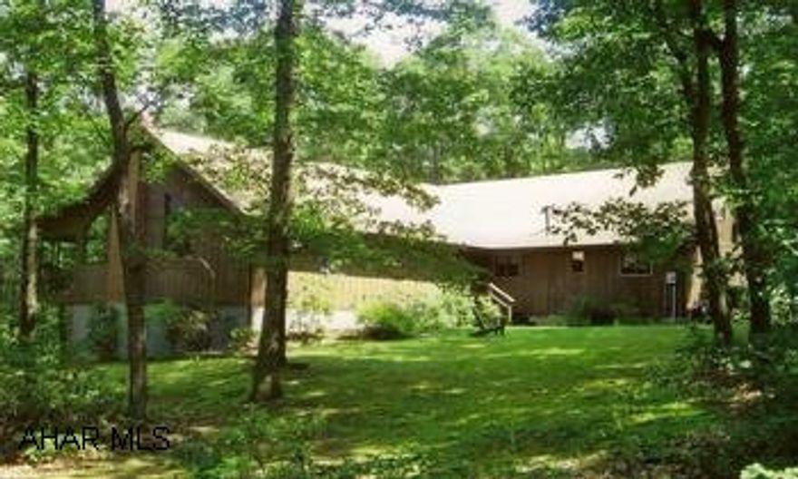 Upscale, cedar sided home RESEMBLING MOUNTAIN LODGE. Upscale, cedar sided, 2544 sq ft home RESEMBLING MOUNTAIN LODGE, on a secluded lot just ten minutes from Bedford. This quality built home offers rustic elegance in every detail. This home offers living roms and dining rooms w/cathedral ceilings. An extra large screened-in porch and deck provide breathtaking woodland views and extra living space. Property includes all furnishings and contents. Heat is geothermal heat pump. Home Warranty.