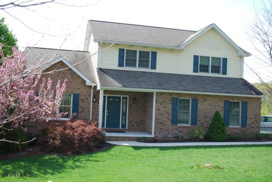 Beautifully decorated and meticulously maintained, this home features a ceramic tile entry, LR with cathedral ceiling and gas fireplace, Berber carpeting.  Screened in rear deck, green house, and a view of the mountains that can't be beat!  Finished bsmt.