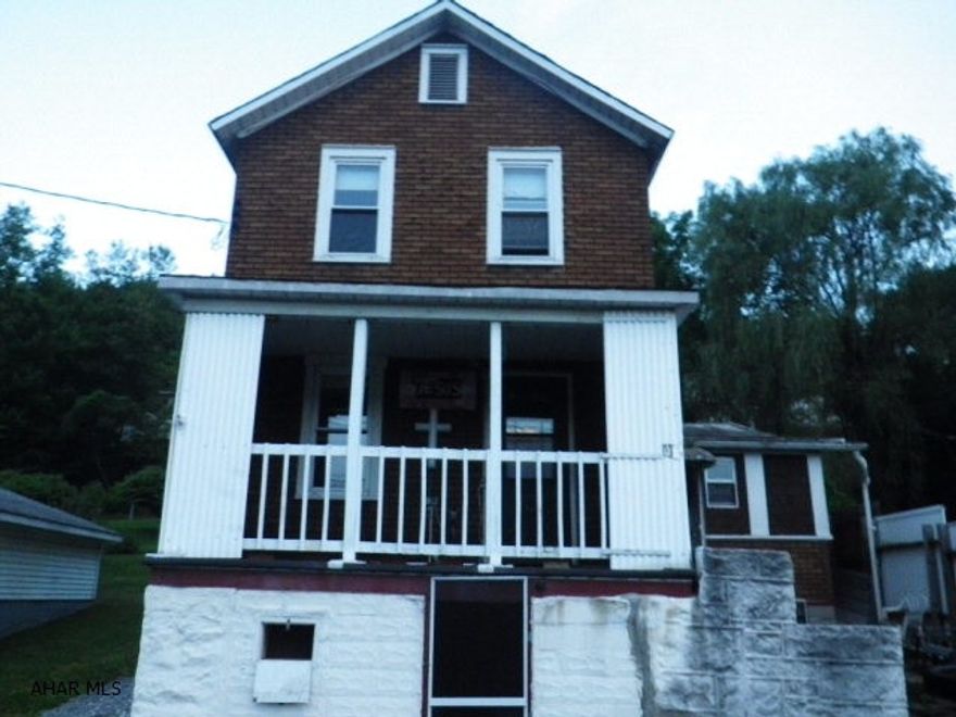 Sturdy 3 BR house with up dated roof, some windows, some wiring. Extra den & laundry room. Good bones