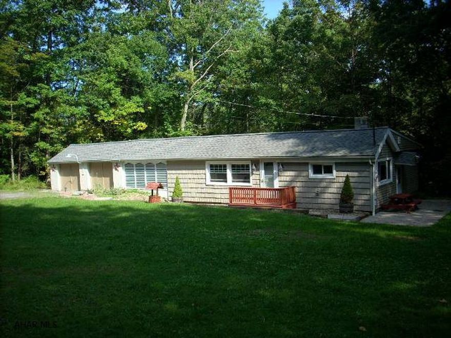 Beautiful setting on Kettle Road, 1.4 acres, very private. Newer kitchen with appliances, thermopane windows, central air, 2 car garage. Stream runs through property. Full basement, woodburner and much much more. Low Taxes!