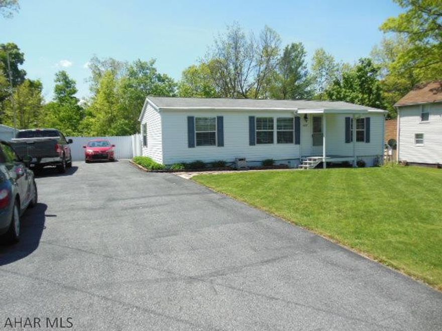 Absolutely Gorgeous, 2008 Fleetwood/Edgewood double wide on block foundation. Unfinished basement that is expansive. Attached rear 4 season porch that has an outside patio and white vinyl fenced lot! Exceptionally clean and neat. 3 BR, 2 BA and front covered porch. Handicap useful, level lot, large driveway for 4+ cars. Don't hesitate!  (Please read agent comments)