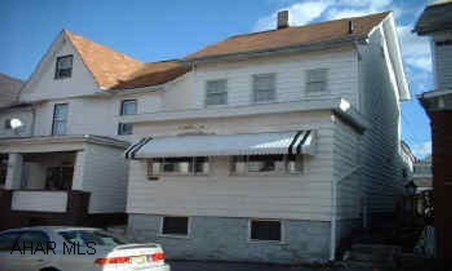 Property sold "As Is" on nice block of 1st Ave.