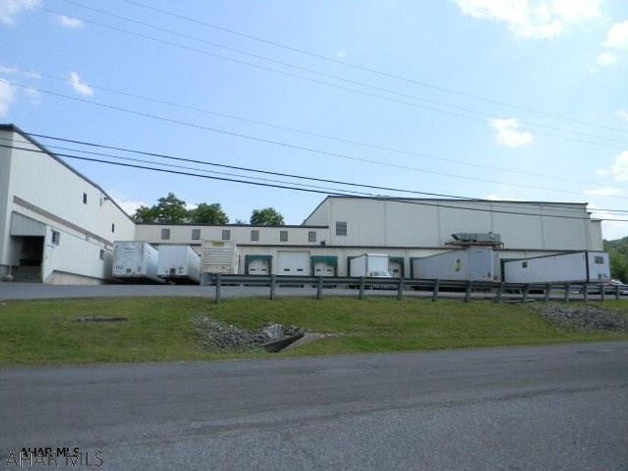 Available for lease, up to 42,500 SF of warehouse and/or light manufacturing space.  Ceiling height up to 22', truck docks and adequate off-street parking.  Price is $4.00 per S.F. on an annual basis.  Amount of lease space is negotiable along with price and terms, space is dividable.  Building is fully sprinkled, three phase electric and has natural gas.  Great location close to I-99 and the Bedford PA Turnpike Interchange. This is a multi-tenant facility.
