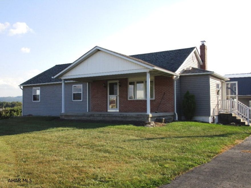 NEW PRICE!!!    Very nice home!  1956-built with 1970's addition & 2011 addition. GORGEOUS country kitchen- alder wood cabinets/center island/ breakfast bar/stainless steel appl's./cathedral ceiling/recessed lights/c. tile back splash!  Brand new carpet on main-level + new vinyl in 1/2 bath as of 8/2016.  Many custom-made, solid poplar doors.  Mostly all replacement windows. Insulated, vinyl siding, brick accent, flue & brick chimney new in 2008.  Basement family rm. with windows for good natural lighting + a cozy gas fireplace. Attic-floored with full stairway access. 2-Sty., 2-car garage with oil furnace & terrific 2nd floor workshop with interior stair access + attach. carport - 2011 new metal roof on garage/crpt.