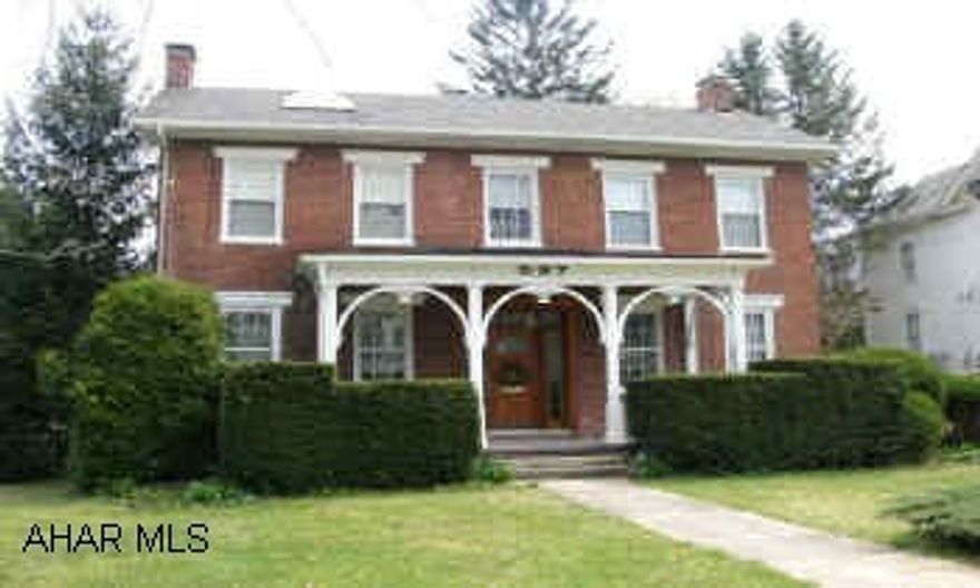 Prestigous 2-story brick. In town on tree lined street. Decorator touches, large deck, screened porch, 3 or 4 bedrooms, living room, family room, dining room, sky lights, chandelier in foyer. Outbuilding used as potting shed/storage.  3-car garage , 2nd story unfinished area. Landscaped, pond with goldfish.