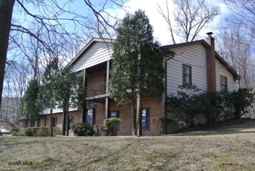 Beautiful home on 10.3 Acres in Sinking Valley! Property features very spacious bedrooms and living area. Updated eat-in kitchen with granite countertops and oak cabinets, master with private full bath, large finished basement with Humungous Family room ,and rec room with a bar and pool table. Attached 2 car garage, shed, and a private wooded back yard near state game lands.  Some of the equipment may stay.  Must see!