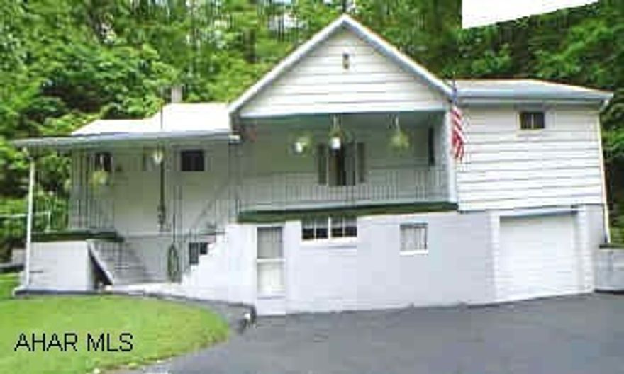 White siding W/ block 4 Br.1Bth,Lots of closet space, Lg. basement W/ pantry and freezer. White siding with block 4BR, 1 bath, lots of closet space, large basement with pantry and freezer.  This 4BR home in Hollidaysburg SD is priced to sell.  Needs new well, seller willing to pay.  Large dry basement, new refrigerator, range, washer, and hot water heater, 5 y/o furnace and 10 y/o roof.  New well to be dug.