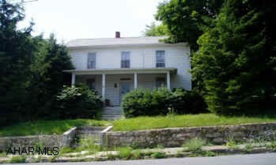 Two-story frame house with newer roof and vinyl siding. Outside furnace. 8 rooms, 4BR/1BA. As Is