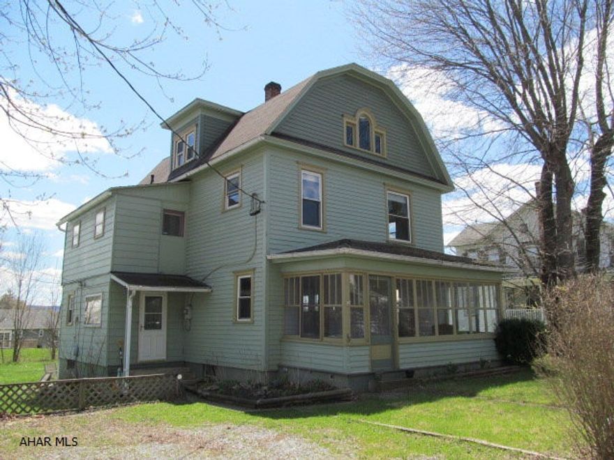 This is a must-see inside.  Beautiful original woodwork, new carpet with HW floors underneath, first floor laundry with 1/2 bath off kitchen, mudroom, enclosed front porch, great foyer with original staircase.  Second floor has nice office/den which could be a BR, updated bath, spacious walk-in closet in hallway and 3 additional BR's.  Rooms are nice and bright with large windows.