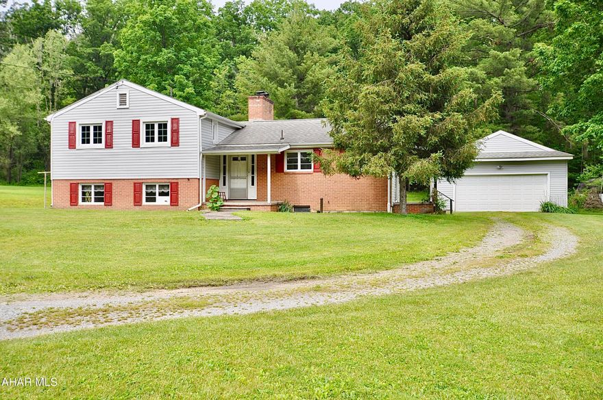 Wow! Wonderful split level home on almost 1 acre just outside of Tyrone Borough in Snyder Township, Blair County. Built in 1972, this home has been lovingly preserved by the original owners and doesn't need a thing to move right in! Two levels of unfinished but dry as a bone basement space you could do anything with. Oversized detached 2 car garage and lots of driveway to park in. Many new windows have been installed, and the roof is about 10 years old. Beautiful quiet location just seconds from town. See the photos, see the house and make it yours soon it will not last.