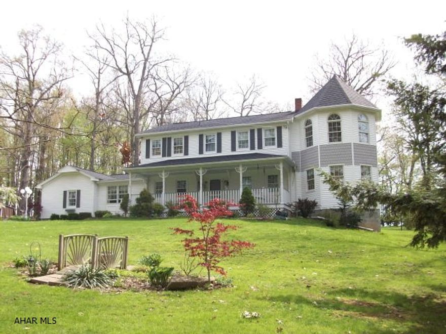 Owner wants offers! Incredibly landscaped home on 8.7 wooded acres, just minutes from Roaring Spring. Includes 30x60 pole building and 40x60 shop, both with concrete floors. Electric bill less than $300 on budget plan even when business was operating. Endless opportunities!