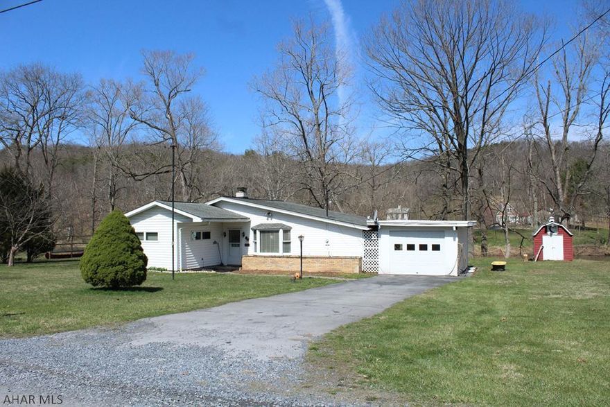 Serene water front property in a quiet little community. Nicely maintained 2 bedroom, 1 bath home with 7+ acres. Enjoy all that the Raystown Branch of the Juniata river has to offer; swimming, kayaking, fishing and just relaxing around the fire taking in your surroundings. The large deck needs some work but offers the perfect space for outdoor entertaining.  3 barns and fenced in pasture land on one side of the road with the house sitting on a double lot on the other. You must come see this home for yourself!