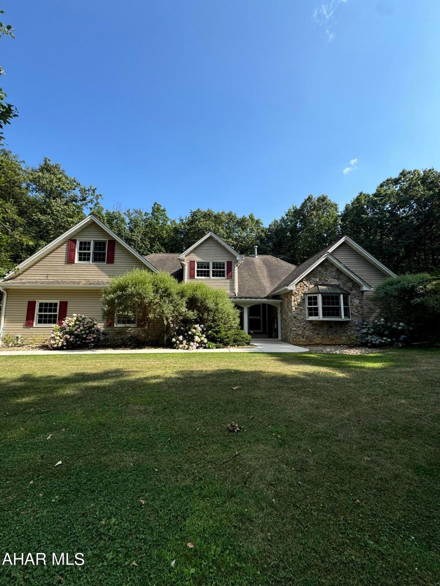 A large cozy home on 3.62 mature acres,  Home offers 5 BR, E/I kitchen open to family room. a huge finished basement with wet bar, an enclosed gazebo overlooking backyard, large outdoor entertainment area with firepit, a sperate large work shop with heat and lights, small basketball court, and extra parking for RV or boats.  House was built with in-law suite on second floor. Taxes and square footage approx.