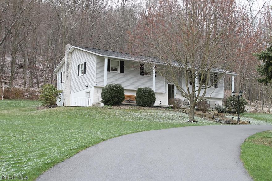 Country living at its finest! Incredible home in Broad Top Township. Meticulously maintained, bright, and airy. All bedrooms are sizable and Master has a walk-in closet. The Harman pellet stove in the living room and wood burning fireplace in the gorgeous Adirondack room make the house warm and inviting.  Full, finished basement is a great hang out space. Huge laundry room has tons of storage. Basement bathroom has a roughed-in shower to make it a full bath. Detached 3 car garage is a dream space, complete with a separate wood stove. Apple trees in front of the garage and a small fish pond in the back yard. Enjoy watching the wildlife coming in from neighboring private hunt club property while you sit on the back deck. Newer black topped driveway is low maintenance.