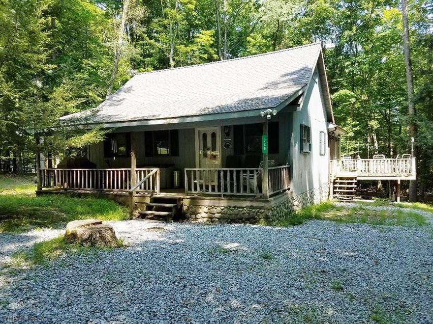 Cute cottage with Great room w/ wood burner & propane fireplace. 2 lots sits back in the pines for privacy. Added feature is the ATV garage in basement. Adjacent from State Park, State game lands & Rock Run