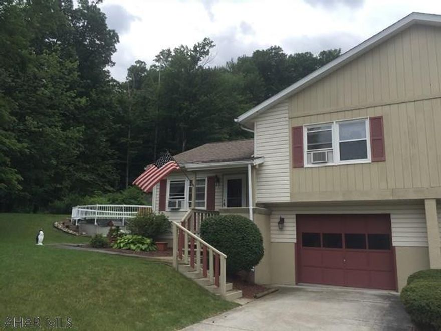 Well maintained Altoona home offers LR w/vaulted ceiling. EIK w/island & appliances, 2 spacious bedrooms & finished lower level family room. Half bath & laundry just off the integral garage. Screened rear deck, patio, and abv. ground pool all located just off Timberline Dr. next to wooded area! This home has newer windows, roof, & basement waterproofing system w/ transferable warranty