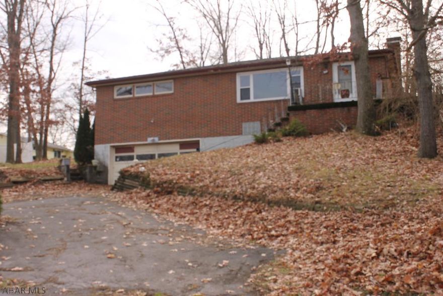 Solid brick home located in a desirable part of Altoona, close to Penn State Altoona Campus! This home has a new furnace, hardwood floors throughout and large rooms with great potential. Two car integral garage with plenty of parking and large basement with for a lot of possibilities. Don't wait to make this home just the way YOU want it! Call to schedule your appointment today. Property being sold in "AS IS" condition
