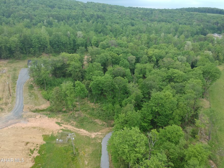 Two contiguous lots (18 & 19) mostly wooded contiguous lots in an approved subdivision being sold for one price.  Perfect for a home building company or a single homeowner wanting acreage with possible future investment returns. Lots will not be sold separately.  Buyer is responsible for contacting the township & appropriate utility (electric, sewer, water etc.) companies to confirm the availability of the utility. Buyer should contact twp. concerning all permits, building codes and creation of necessary streets as per twp. regulations.