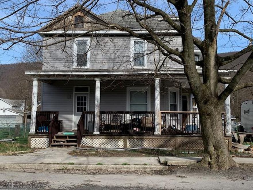 A 2 story home on a corner lot has lots of potential with a large car garage and plenty of storage!  Seller started to put new siding and a metal roof on but still needs finished.  Garage is newly sided but needs a new garage door.  AS IS WHERE IS!  Taxes include fire protection and street light.