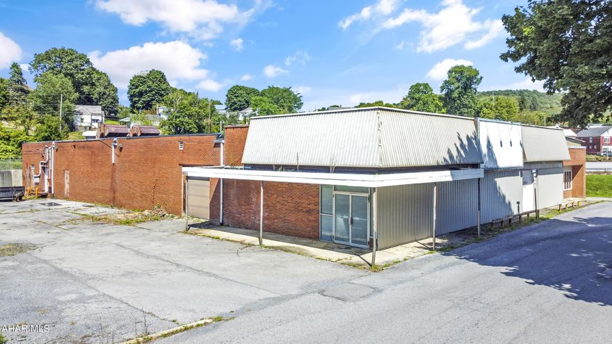 Spanning an impressive 0.86 acres, this expansive 14,000 square foot building offers a wealth of opportunities. Currently home to 20 storage units and a leased commercial storefront, it boasts ample additional space for expanding existing operations or launching a new venture. Significant upgrades have already been initiated, including new electrical work throughout the building, with just a few finishing touches needed. The property also features a picturesque backdrop along the Blacklick Creek and includes a spacious parking lot to accommodate your needs. Don't miss out on this exceptional opportunity—call today for more information!