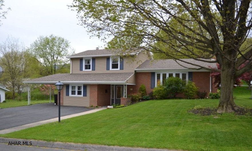 Tastefully updated 4 Bed 1.5 bath home on a level lot in Bedford.  New vinyl siding, and all new vinyl windows.  Updated kitchen with glass backsplash and all new stainless appliances.  Lots of space with living rooms on both floors.  Lower living room includes a brick fireplace and opens to the back paito, upper living room has large bay window.  Paved driveway with carport, also an underground pet protection fence.  Move-in ready.  Call us today!