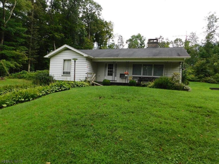 This home is a 1 owner and has been very well maintained. Brick fireplace is living room beautifully kept, original hardwood floors. Sits off the road for quiet and privacy-wildlife included!