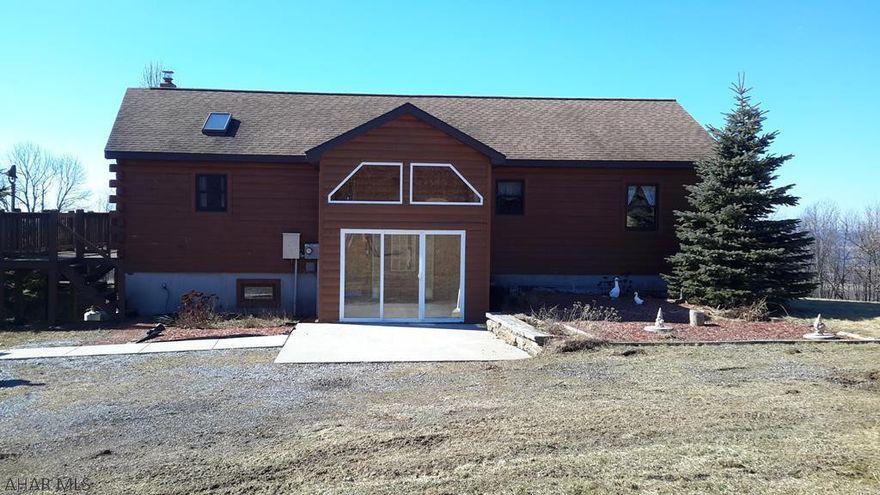 Country living at its best with room to grow on 7.5 acres! Log home built in 2005 w/detached 2 car garage and 2 story workshop w/additional 2 garage spaces. Mature fruit trees & plenty of space for vegetable garden. Inside the split entry, walk up to the open concept living space w/cathedral ceilings and stone wood burning fireplace. Large windows and skylights for plenty of natural light. Ash hardwood throughout the main level with tongue & groove ceilings throughout. Multiple decks and heated sun room to enjoy all year! Lower level is studded and ready for finishing. Very nicely maintained home. Call to see this property for yourself! PLEASE DO NOT DRIVE UP LANE! CALL FOR SHOWING