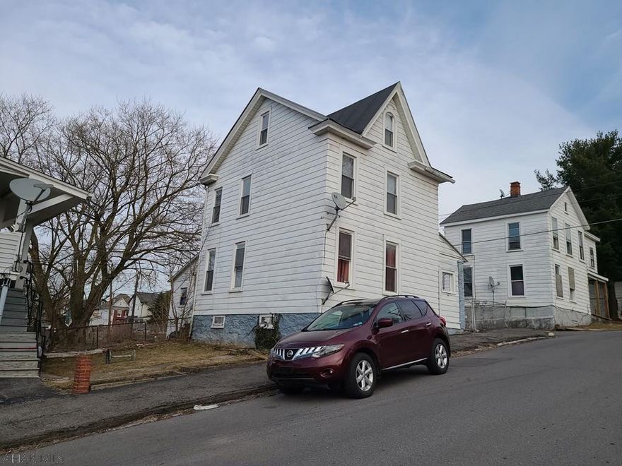 Affordable 3 bedroom home in the city.  Features include a fenced-in front yard, a covered porch, 1st-floor laundry, high ceilings, large interior doors, a finished attic (no heat), updated windows & a newer furnace.