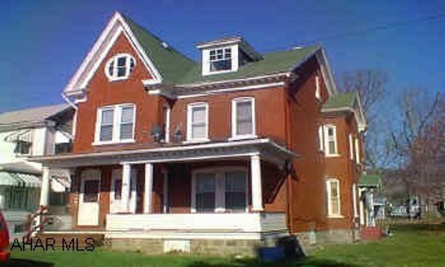 2.5 story ,brick duplex, w/ 2 car garage in rear