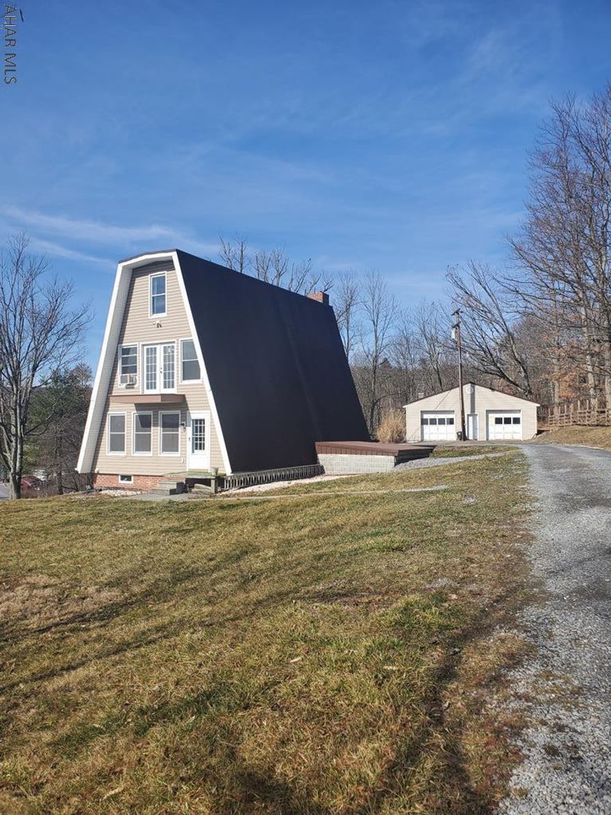 Unique A frame home with 4 bedrooms and 2 bathrooms on just shy of an acre . Detached garage and above ground pool. Many updates.. Awesome views. Schedule your tour today.