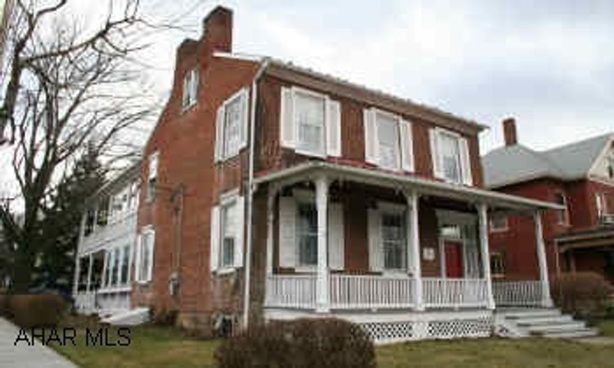 Brick 2-story Colonial home located in town. 2 covered porches; brick courtyard. Enclosed porch on 2nd floor, new custom kitchen, formal DR, LR w/fireplace. Center-hall design, chandeliers, oak flooring on 1st floor, yellow pine on 2nd level.  Yesteryear's Treasure For Today's Living. Large laundry/utility room on main level. Finished 3rd level bedroom provides aditional sq. ft.