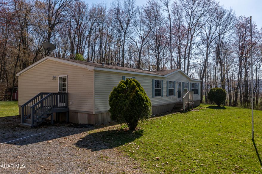 Spacious  3 bedroom , 2 full bath home surrounded by 2.26 acres in the Williamsburg  School District .This home features a large kitchen and dining room area and living room with a fireplace. Enjoy privacy on your own Master Suite with a master bath with jacuzzi tub and walk in closet. Carport and parking. A huge yard for a garden and out side entertaining. This is a must see. Schedule your tour today.