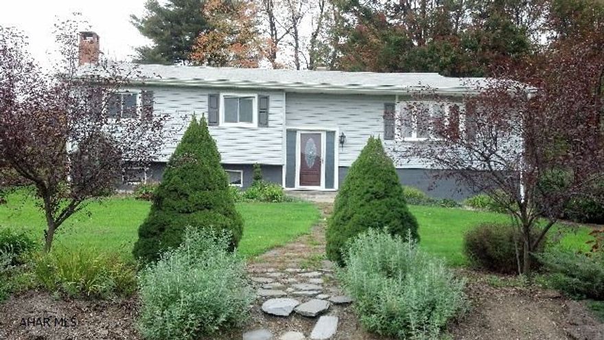 Beautiful home - new kitchen, new carpeting, spacious living room, large enclosed patio area/bonus room.  Beautiful piece of land leading to stream.  Semi-finished basement with bar area and fireplace.  Won't last!