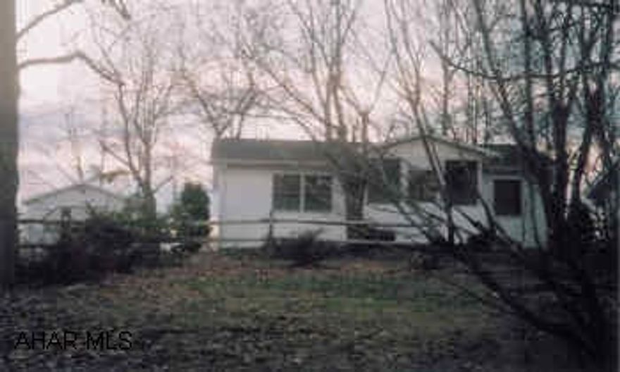 One Story Frame Dwelling with detached garage.