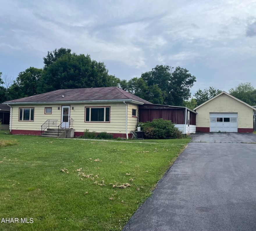Deadline for all offers is 6/7 at 5:00PM! Location, location, location! This 3 bed, 1 bath off Loop Road has so much potential! The massive, paved driveway and garage offers plenty of off-street parking and the flat yard provides curb appeal that is easy to maintain. The living room leads back to three bedrooms with spacious closets and the large bathroom offers plenty of storage. A screened-in porch stems from the kitchen - perfect for entertaining! With a little TLC, you've found a gem right in Hollidaysburg! Call for your tour today!