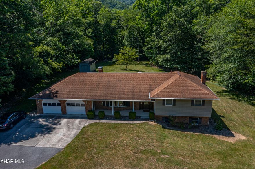 Beautiful multi level home on 2.01 acres in Bedford! A long paved driveway leads you to the house that sits on a private lot.  The home features a covered front patio area, three car garage and a unique multi-tiered deck out back with a canopy that stays with the property.  The inside living space is meticulously maintained with updates throughout. It features 3 BR, 2BA, central vac, central air-the list goes on!