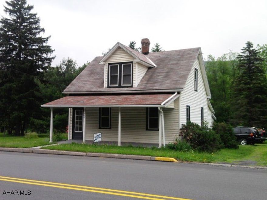 1 1/2 story, 3 bedroom home with 2 full baths. Large lot. 2 car detached garage.