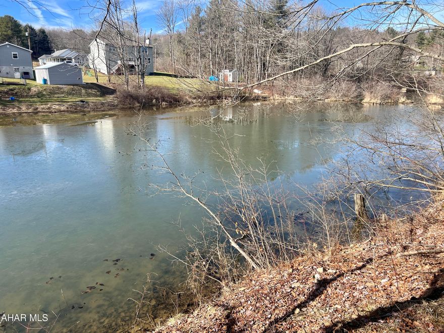 7+/- acres with lake frontage on Cresson Lake. This property would make a great location for a getaway or full-time residence. State Game Lands No 279 is nearby along with the Cresson Lake Playhouse. Property has been recently surveyed.