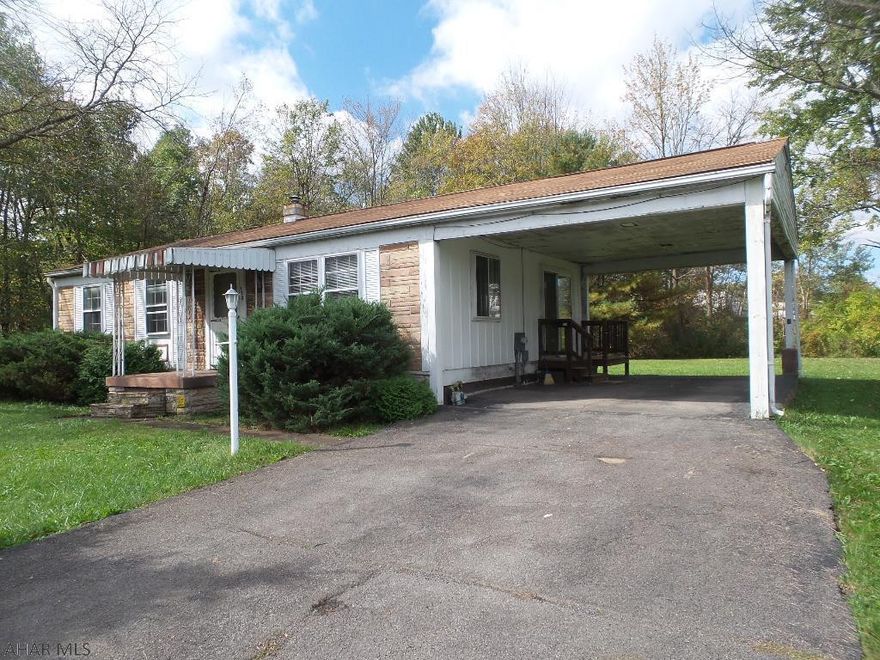 Ranch home on double lot - 100x120 - in Bellwood Borough!  Public water and sewer, hardwood floors, 2 or 3 bedrooms, laundry is on the main floor.  Newer gas forced air furnace, carport.  House needs TLC and does get water in the basement.