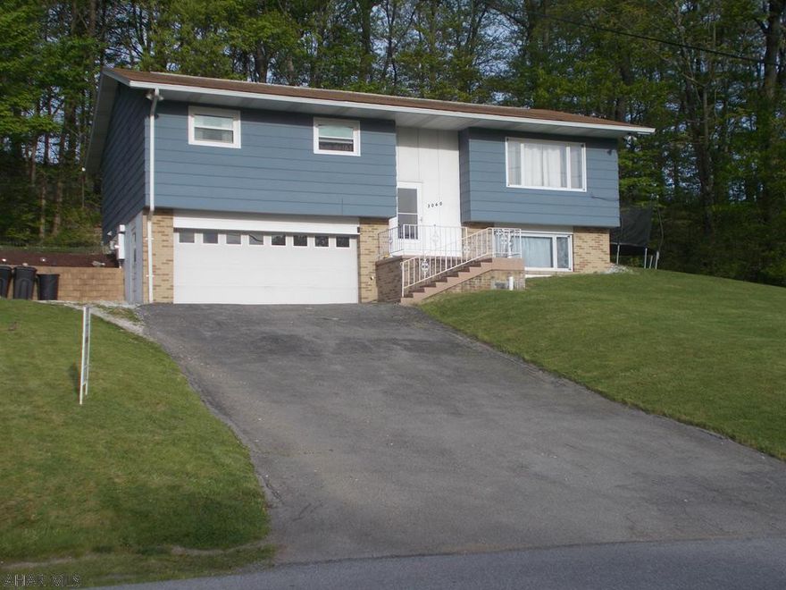 So much larger than it looks .  Four bedroom, 2 BA home on a private, partially wooded lot located on a dead end street in the desirable HASD.  Home has a mini split heat pump to keep the utility costs down. Check out the granite counters, stainless appliance and newer self-closing cabinetry in the kitchen with built in washer and dryer.  House sits up high to take advantage of the view. This is a must see home.