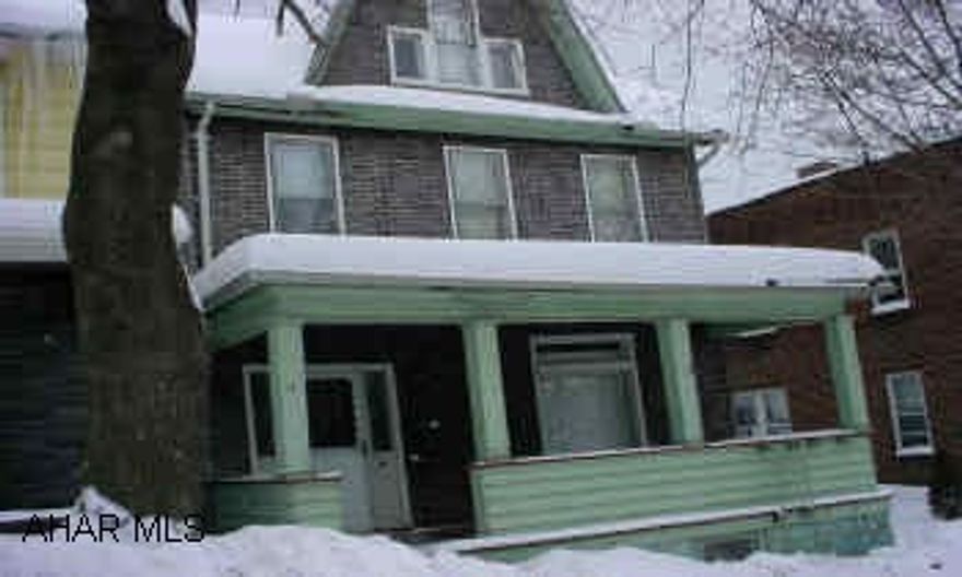 Vacant duplex. Could be a single family home.  Purchased "As Is"