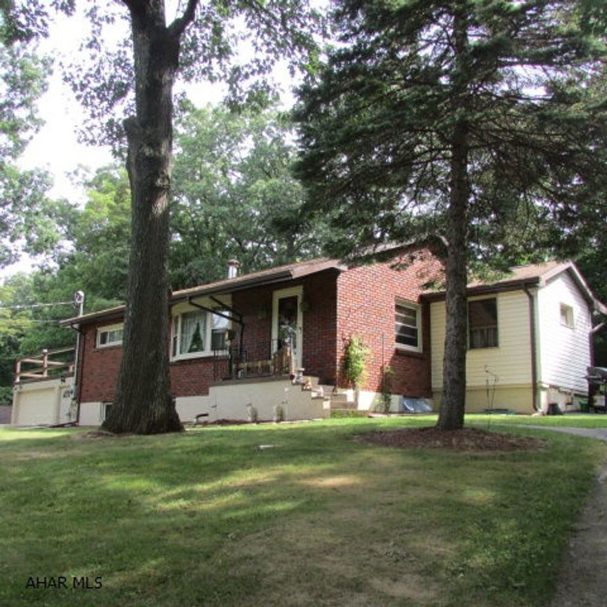Well-maintained brick ranch home on over half an acre - Frankstown Road. 2 Bedrooms, 1 bath. Large family room can be divided to accommodate a 3rd bedroom. 'Upflush' line is installed for bath on lower level. Lots of new here - kitchen, shower in bath, landscaping/drainage, spouting, well pump, pellet stove. Property backs to woods - wildlife sightings. Has a circular driveway with four parking spaces. Part of back yard is fenced. Attic walk-up - lots of storage. A cozy home - comfortable inside and out. Don't just pass it by, pull in take a close look - you'll like it!