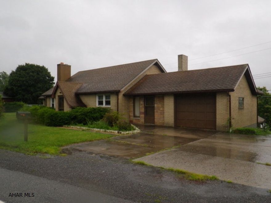 Ebensburg- 3 BR brick ranch decorated with wood trim throughout. plaster walls, modern kitchen with appliances. 3 baths. Dining room & family room. finished basement. Gas FA heat. garage. 3 extra separately deeded lots. A must see!