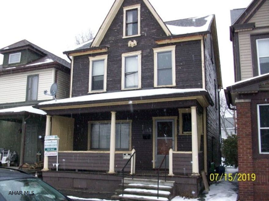 Investor special.  New roof in 2012.  Large bedrooms, 1/2 bath on main floor, large finished walk-up attic.  Lots of original woodwork in fairly good shape.  Has always been heated.  Off street parking.  Needs work, but structurally sound and in a good area.
