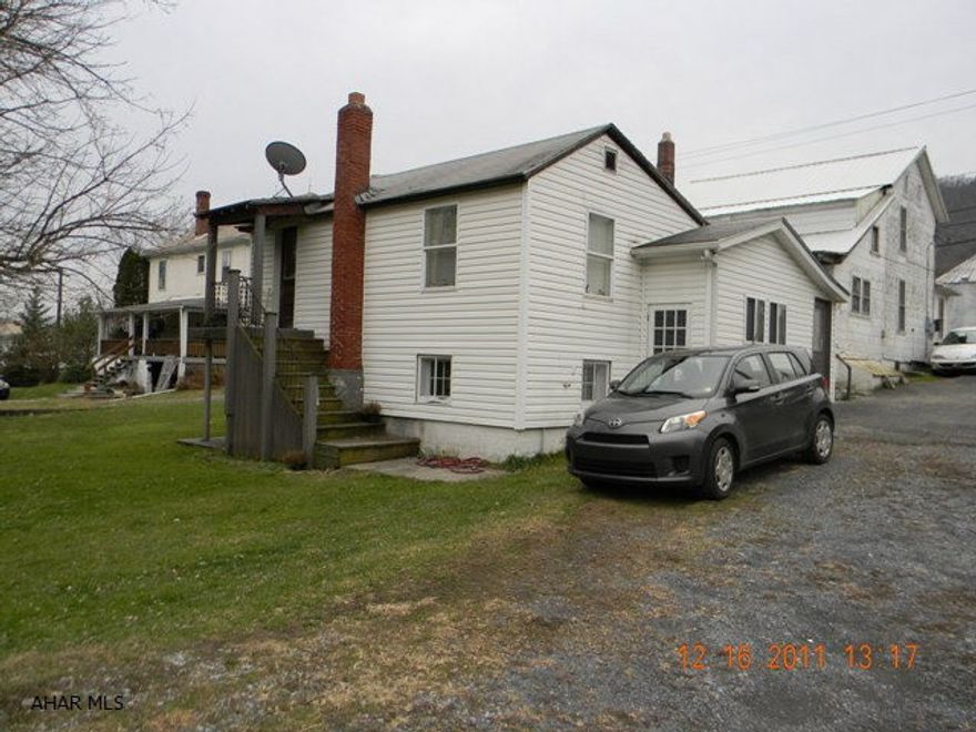 Tons of potential. 2.43 acres w/public water & sewer. 2 rental houses, 5-unit Apt building & 3 mobile home lots.Houses are rented at $485.00 & 450.00 per month, Apt building vacant- needs work. All separate utilities. Room for expansion- Mobile homes or townhomes.