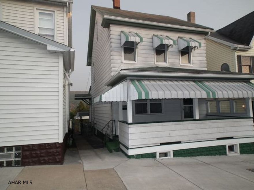 2-3 bedroom home with 2 car carport, fenced in yard, roomy living rooom and dining room, serving bar from kitchen to dining room, covered porch and patio, thermo windows and central air.