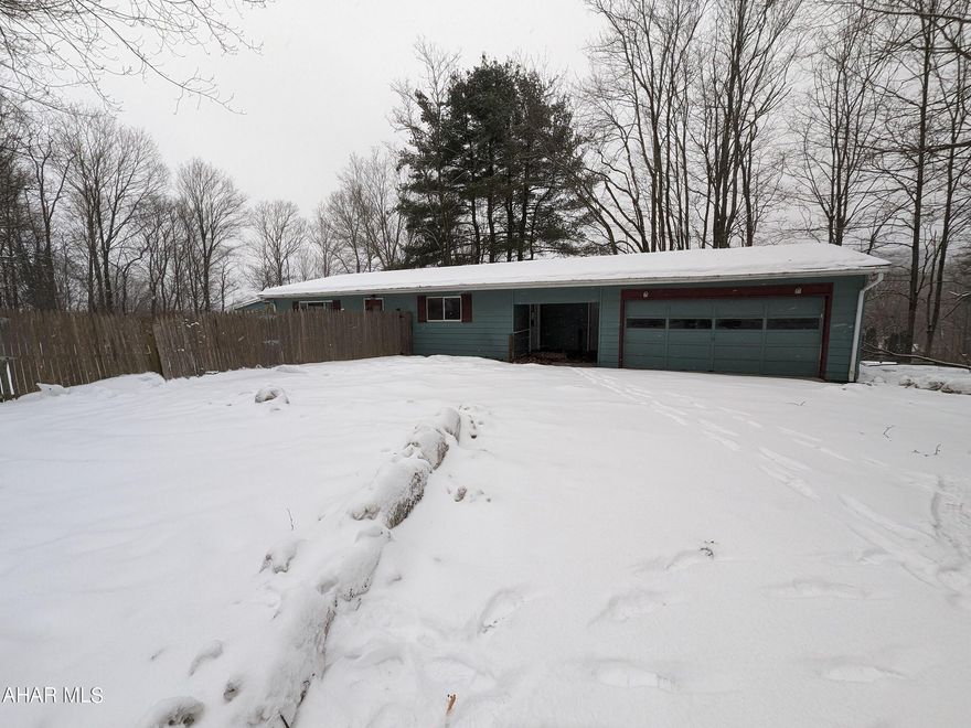 One story home in Bellwood School District on 1 acre! Large eat-in kitchen with adjoining great room for a truly spacious feel. Two first floor bedrooms and bath plus first floor laundry. Basement is semi-finished with loads of possible additional living space. 3rd bedroom and 2nd bath in basement are roughed-in and need significant work to be made functional. 2 car attached garage, side covered porch and loads of possibilties! AS-IS sale. Seller will make no repairs. Portions of roof are moss covered. BUYER PAYS BOTH TRANSFER TAXES AND DEED PREP.