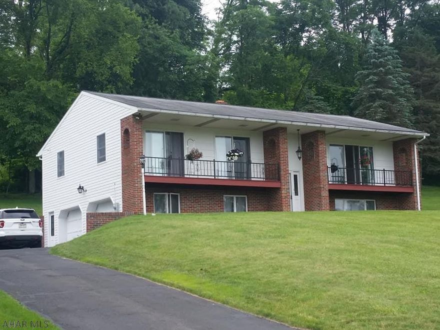 Located the Meadowbrook community of Bedford with an open floor plan, large windows and natural light, balconies off of the main living room, 2 of the bedrooms/offices. This 3 bedroom, 3 bath home is in move in condition w/ many updates including, beautiful real hardwood floors and ceramic tile throughout, a new all season sunroom, new paint, new stainless steel appliances and new siding. Enjoy a quiet setting from the backyard and sunroom and mountain views from the large double sliding in the living/dining room. The lower level offers a very large finished room with a stunning gas stone fireplace, a laundry room, bathroom and a two car garage. Some other perks include lots of storage, well insulated/energy efficient and keyless entry. Great home, great location.