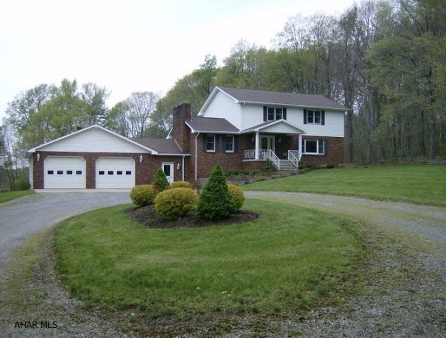 Ebensburg- 4 BR, 2  bath Brick & vinyl home on private 3.3 acre lot in Cambria Twp. Gas HW baseboard heat. Public water. 30 x 40 attached garage. Many extras! A must see!